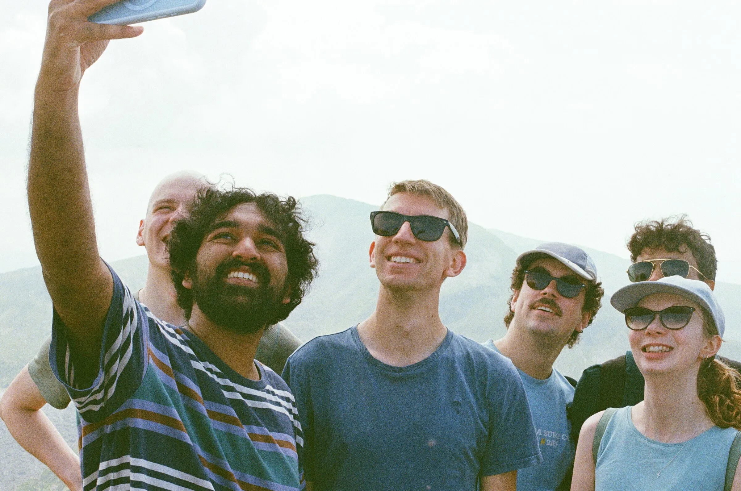 A group selfie on a hilltop
