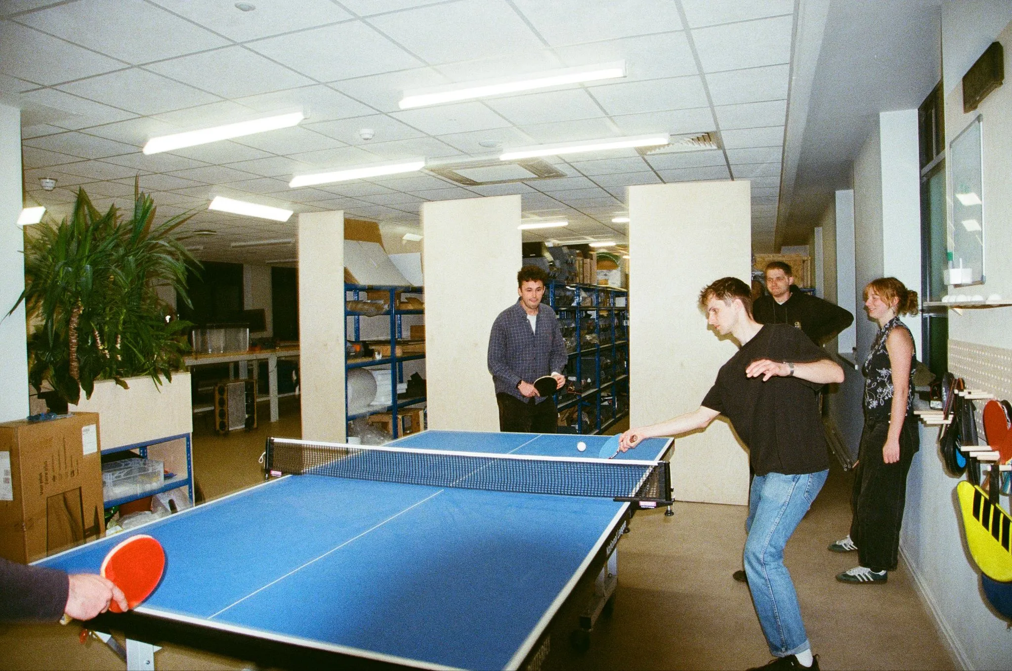 A game of table tennis in an office
