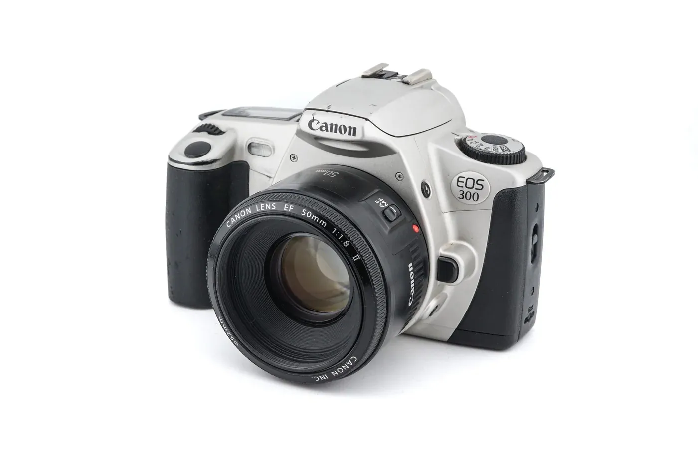 A silver Canon EOS 300 with a 50mm lens