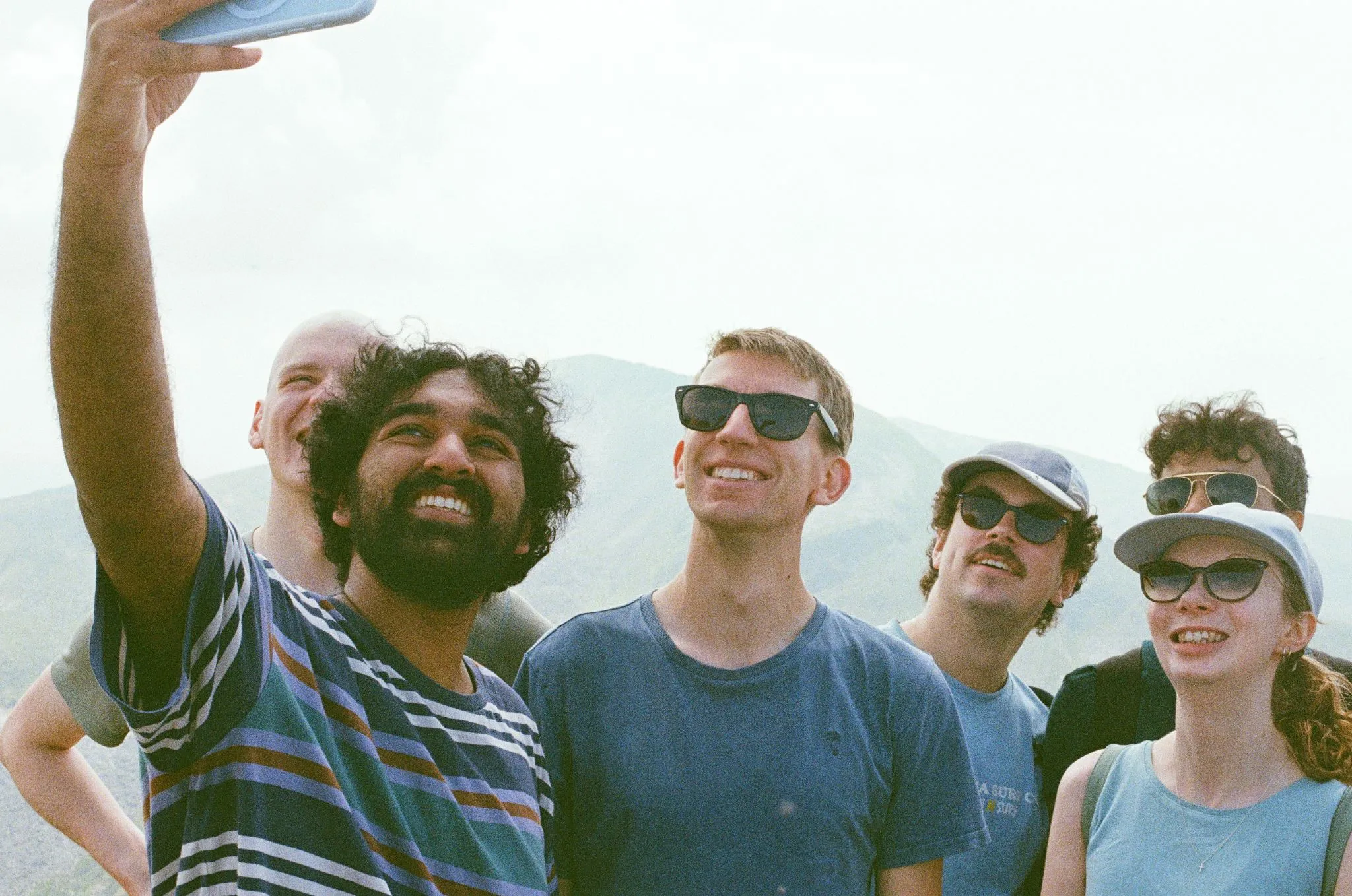 A group selfie on a hilltop