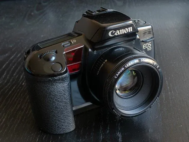 A black Canon EOS 10 with a 50mm lens