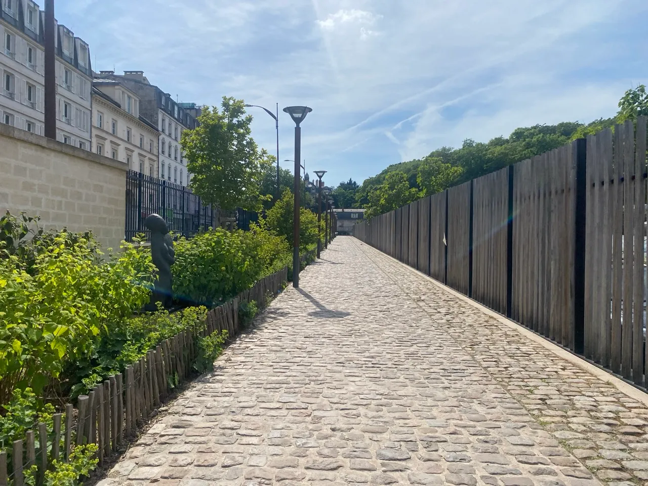A decadent new pavement in Sèvres, Paris, with fountains and statues