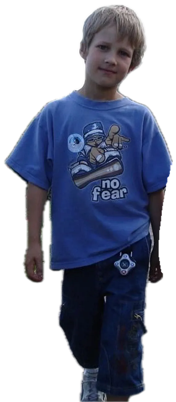 Thomas as a boy, in a no fear T-shirt with a compass on his belt
